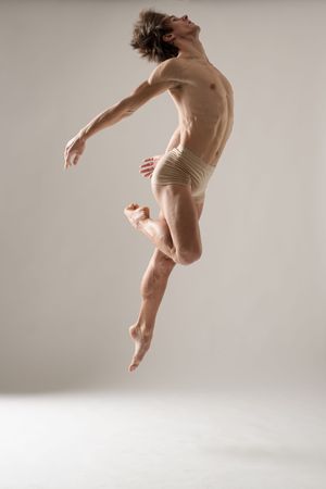 Artistic sequence of a dancer leaping gracefully in nude-colored attire against a light background.
