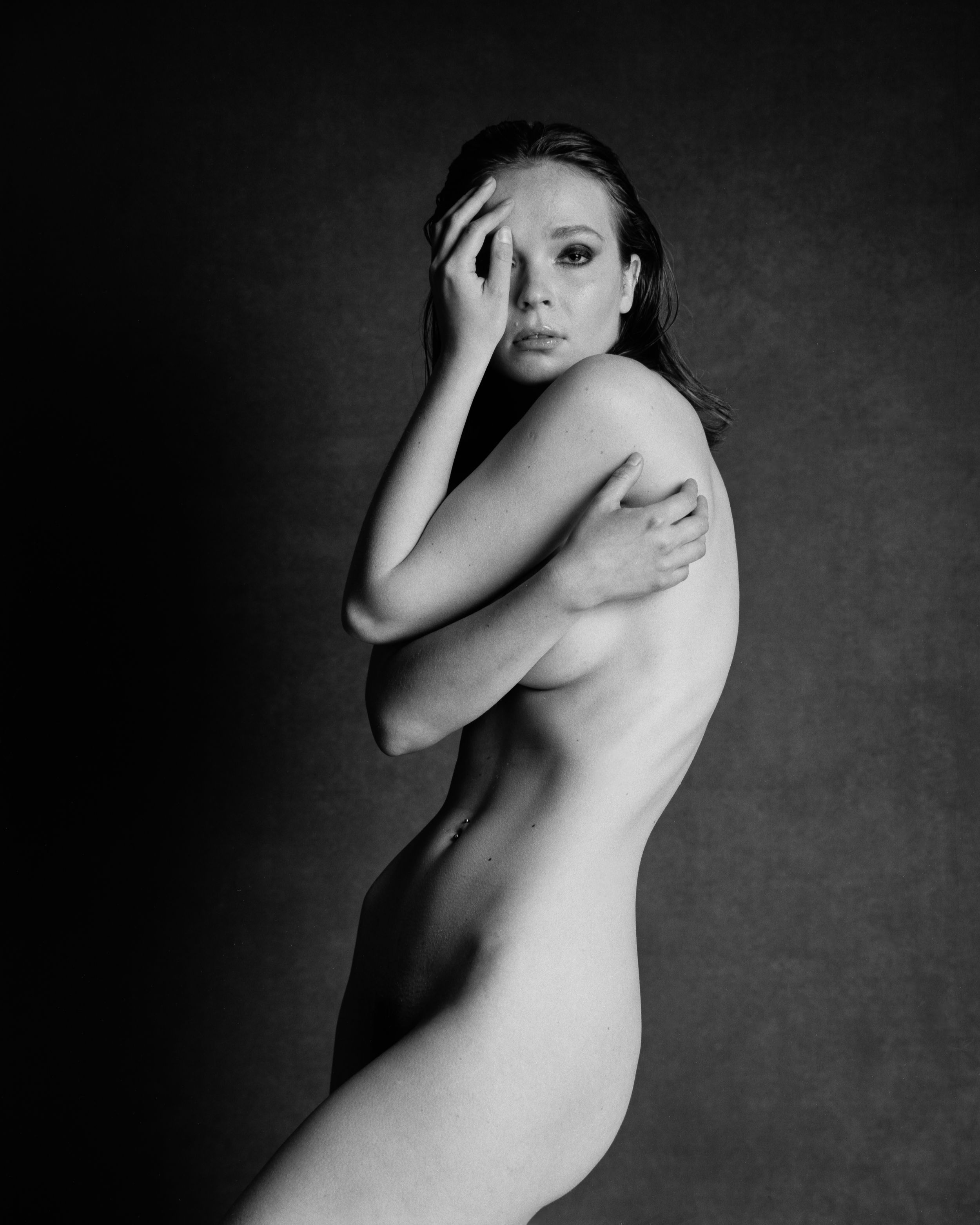 Artistic black and white nude photography series with minimalist composition.