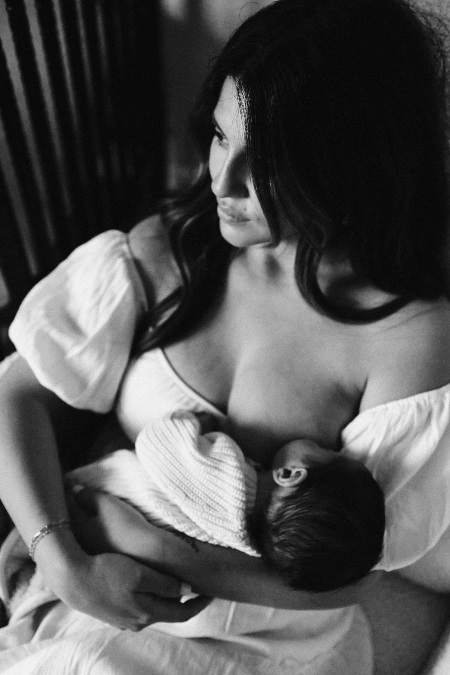 Intimate black and white photographic sequence showing tender moments and gentle embraces.