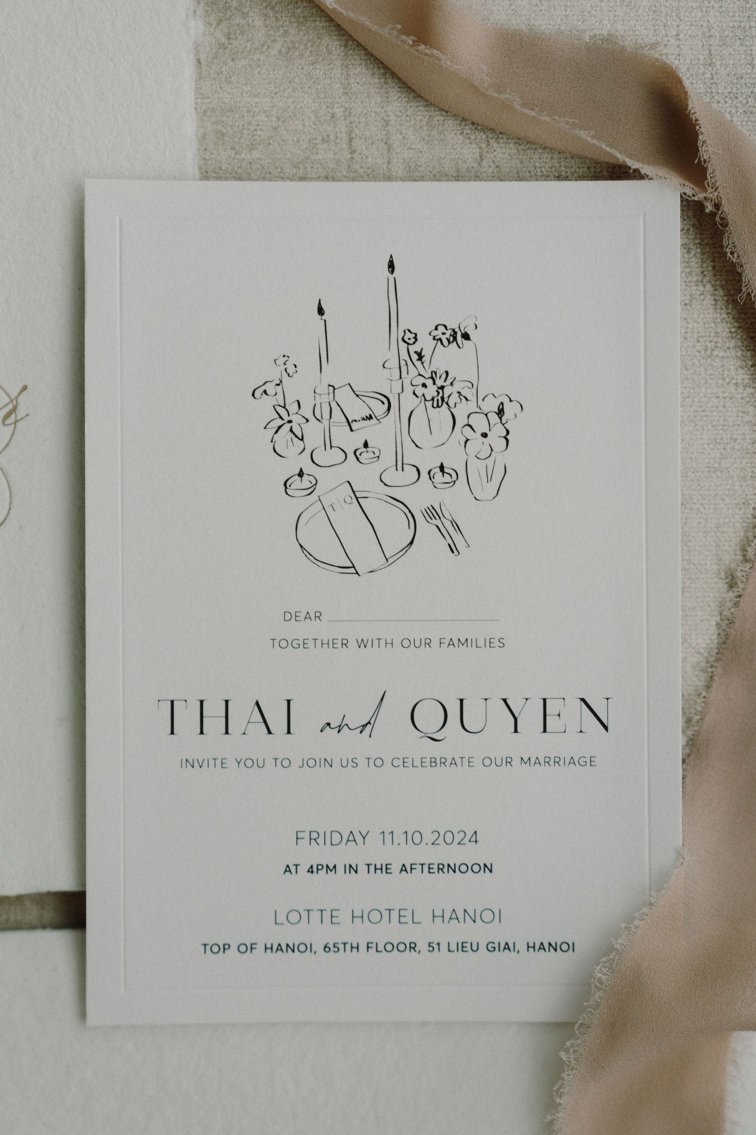 Elegant wedding invitation details with minimalist lettering on white paper.