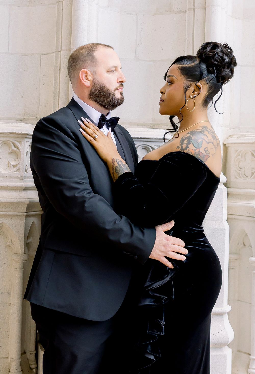 A couple in formal attire shares an intimate moment against a white marble column in a series of romantic poses.