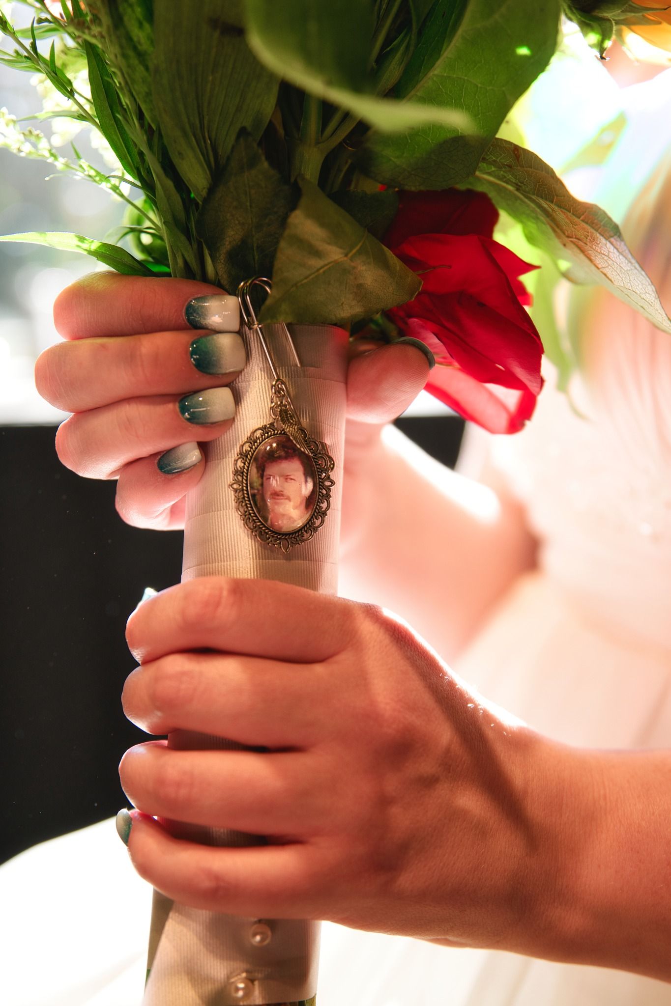 Close-up sequence of hands preparing herbs, showing a person grasping and holding fresh green plant material.