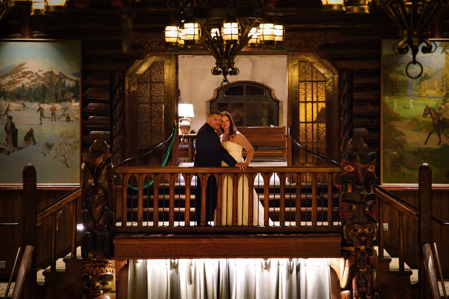 Elegant wedding reception venue with warm lighting and rustic architectural details.