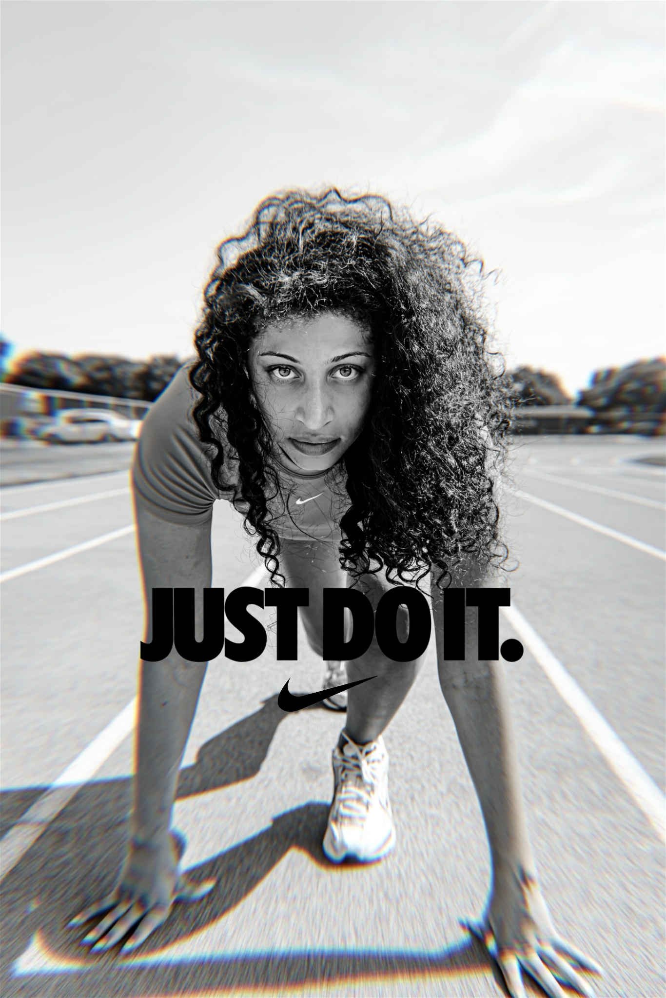 A black and white Nike advertisement showing an athlete in starting position on a track with 'JUST DO IT' text overlay.