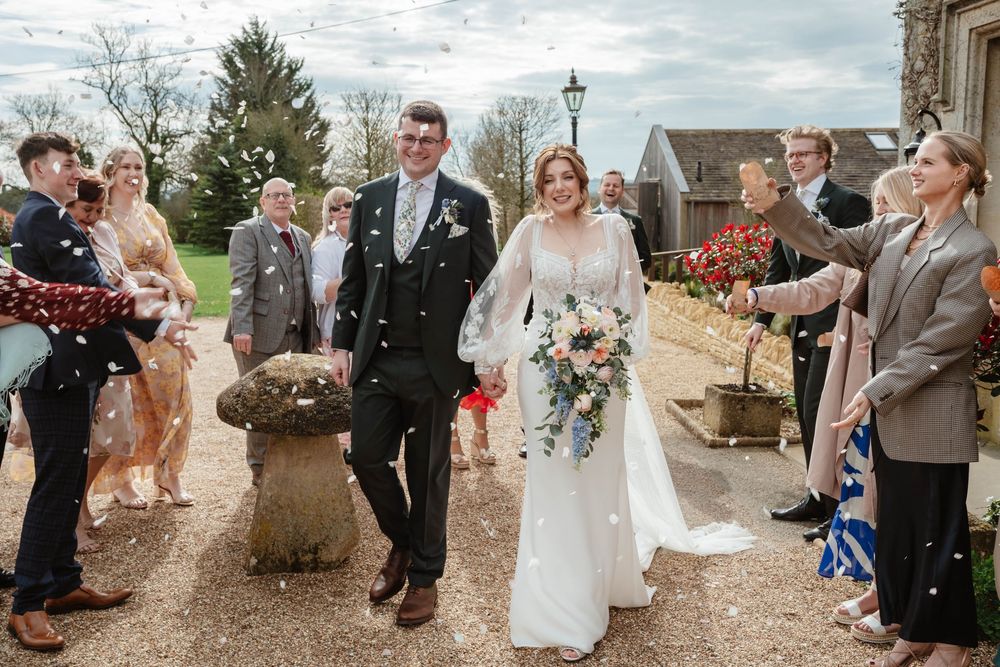 Hyde House Wedding Photographer Cotswolds Zara Davis Photography Gloucestershire Cheltenham bride groom confetti front of house