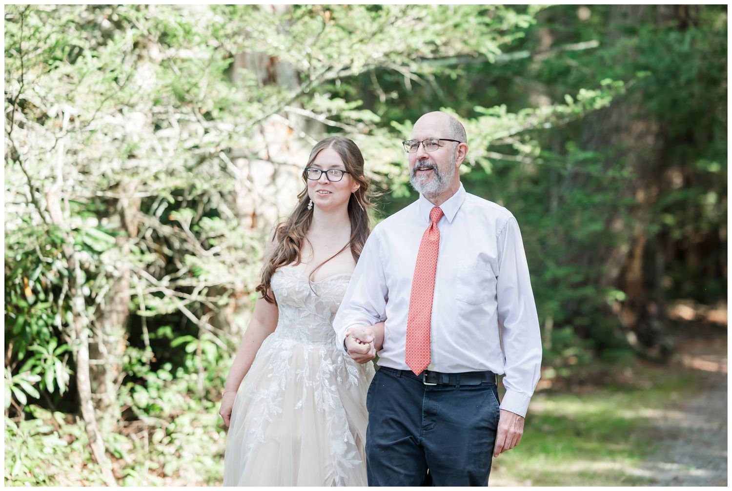 Romantic outdoor wedding photos captured in a lush garden setting with natural greenery and white decor.