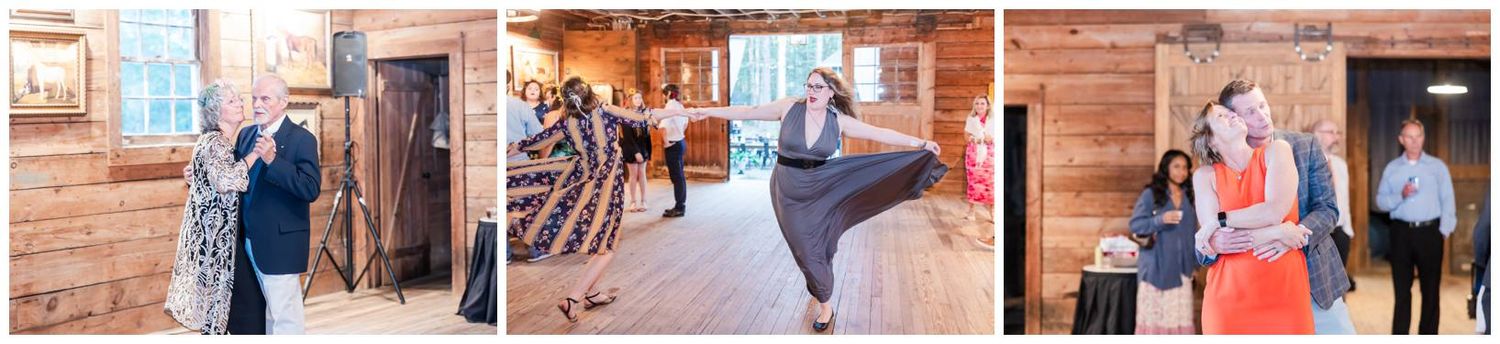 Wedding party dances together during reception celebration in rustic barn venue with wooden beams and string lights.