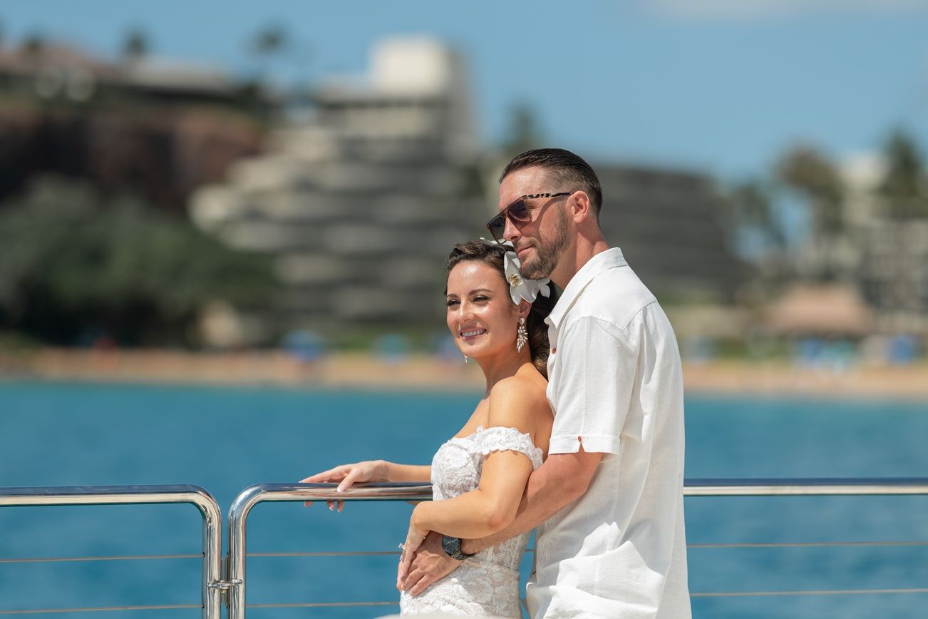 Maui wedding photographer photo against beautiful Maui Trilogy Sailing Boat by ohwowfotos.