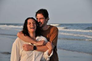 Couple poses during an outdoor couples photography session.