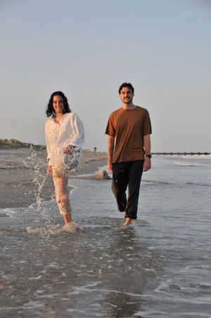 Couple poses during an outdoor couples photography session.