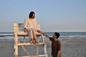 Couple poses during an outdoor couples photography session.