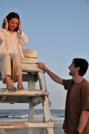 Couple poses during an outdoor couples photography session.