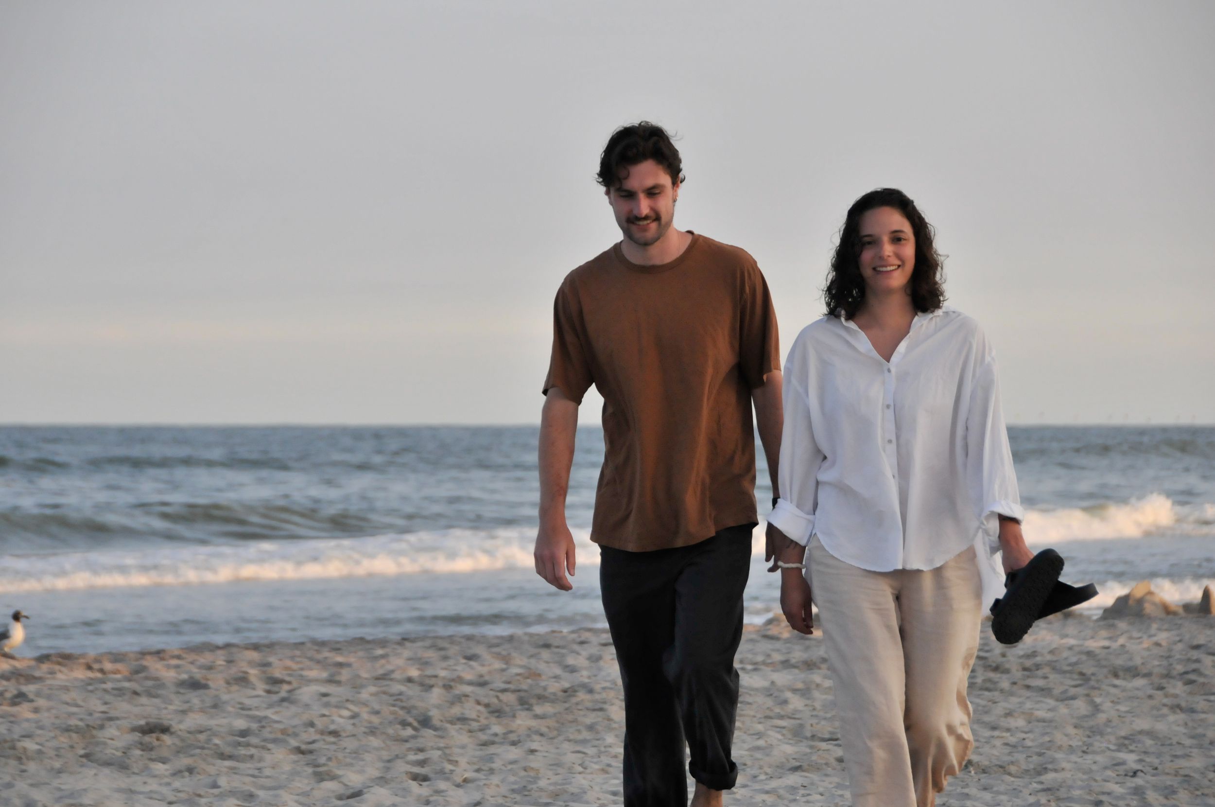 Couple poses during an outdoor couples photography session.