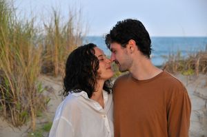 Couple poses during an outdoor couples photography session.
