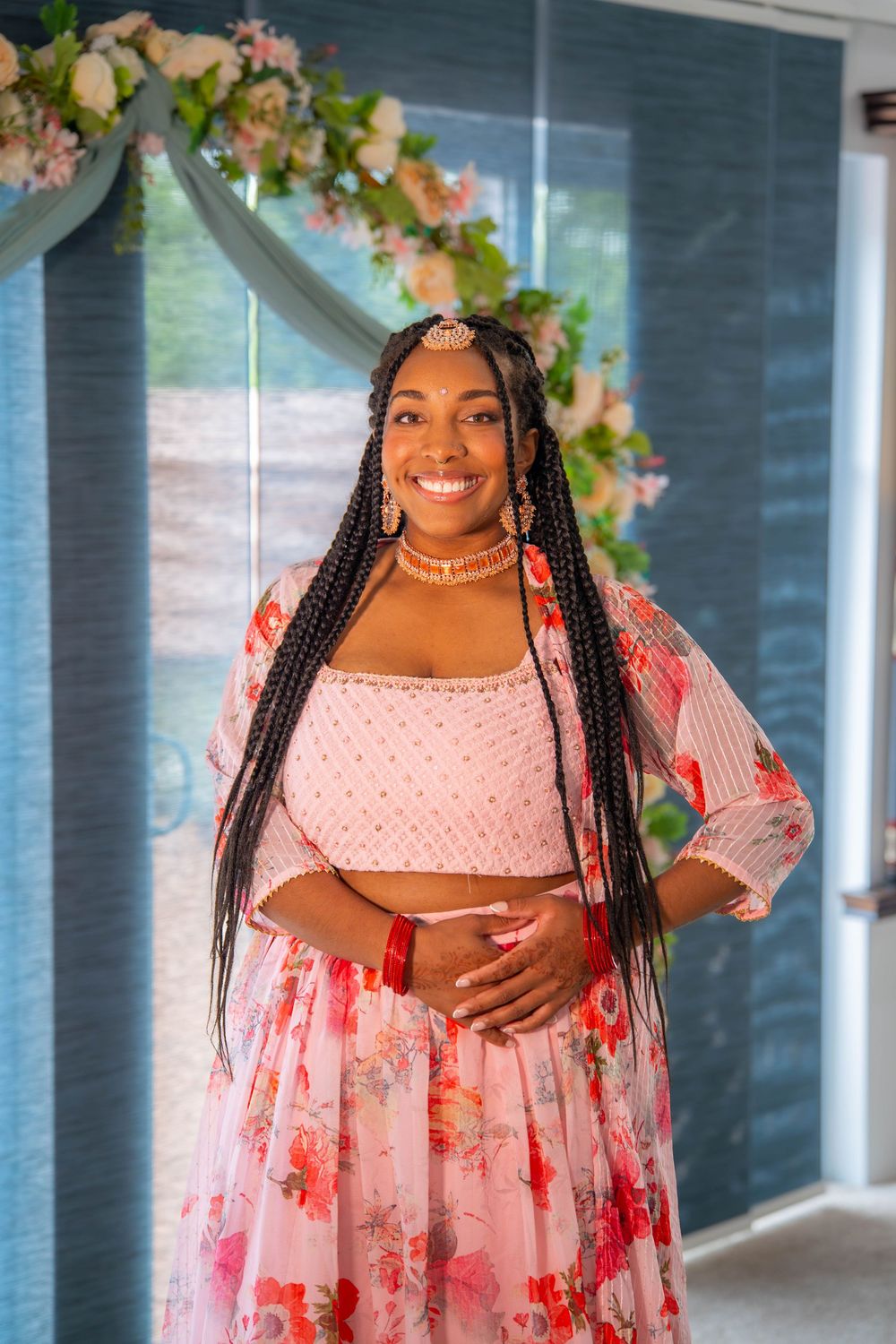 A person in a pink floral dress with puff sleeves. Nischitartham Quad Cities Hindi Indian Photographer