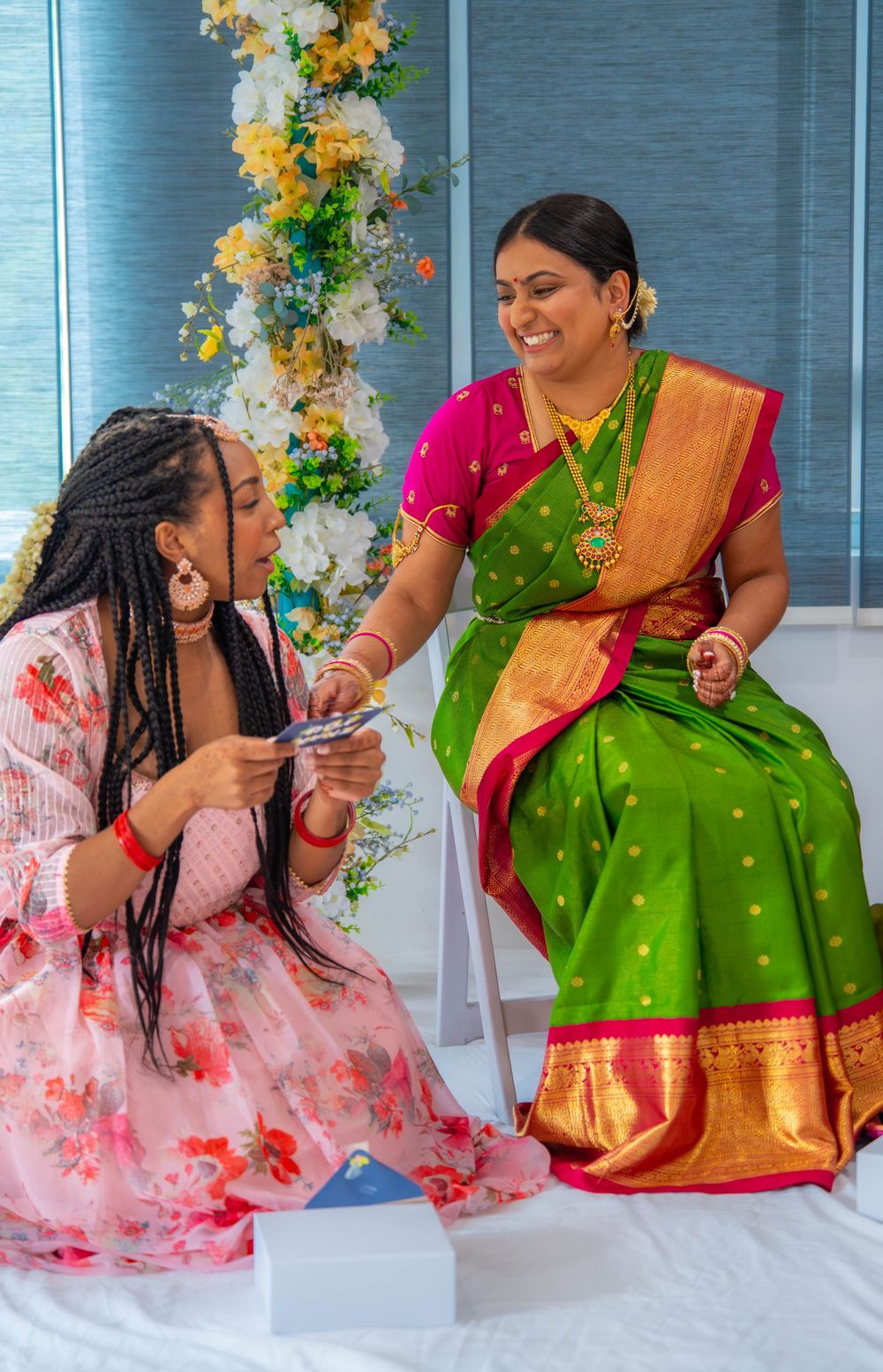 Friends in festive Indian attire share joyful moments during a celebration. Nischitartham Quad Cities Hindi Indian Photographer