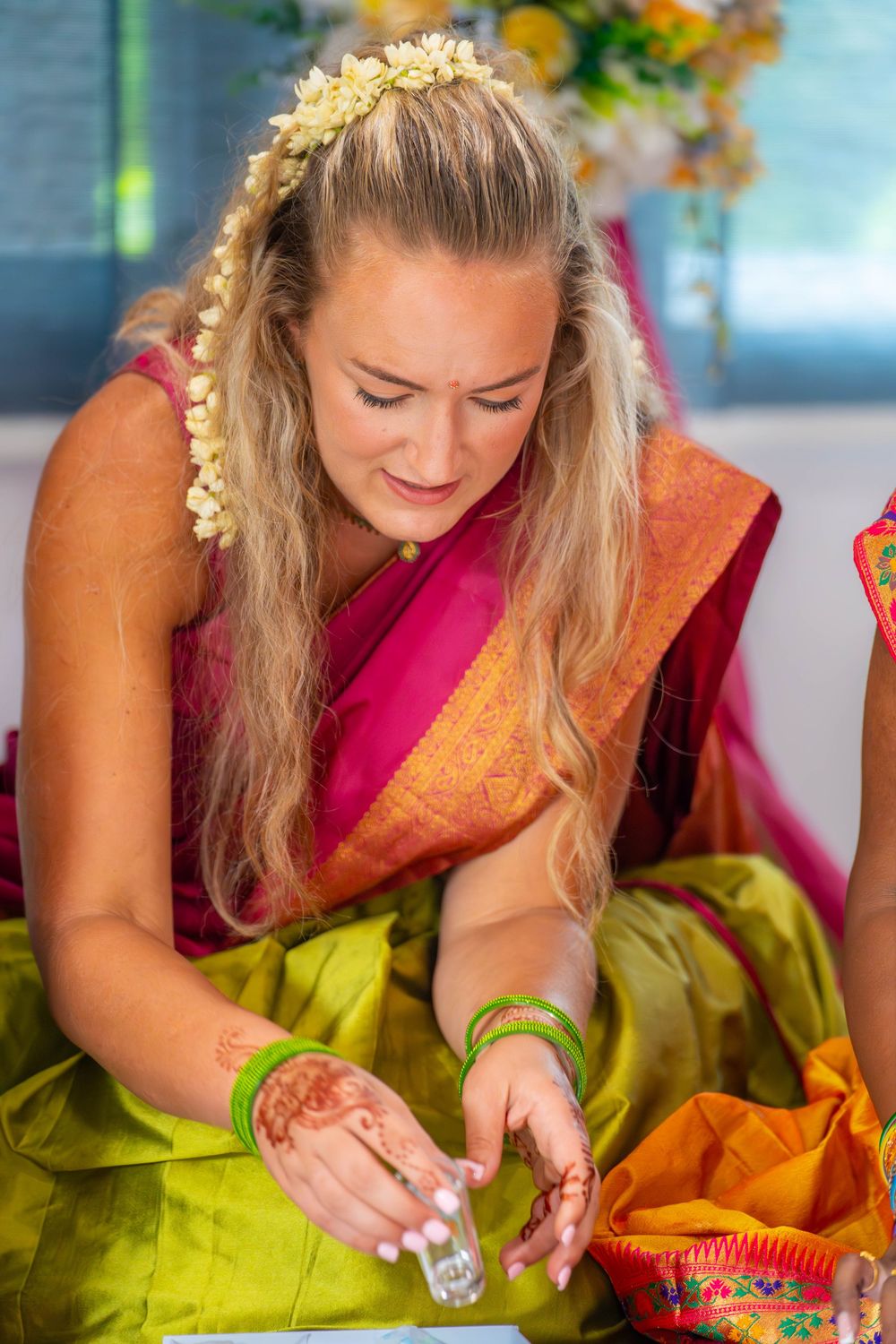 Sequence showing someone in traditional Indian attire opening gifts. Nischitartham Quad Cities Hindi Indian Photographer