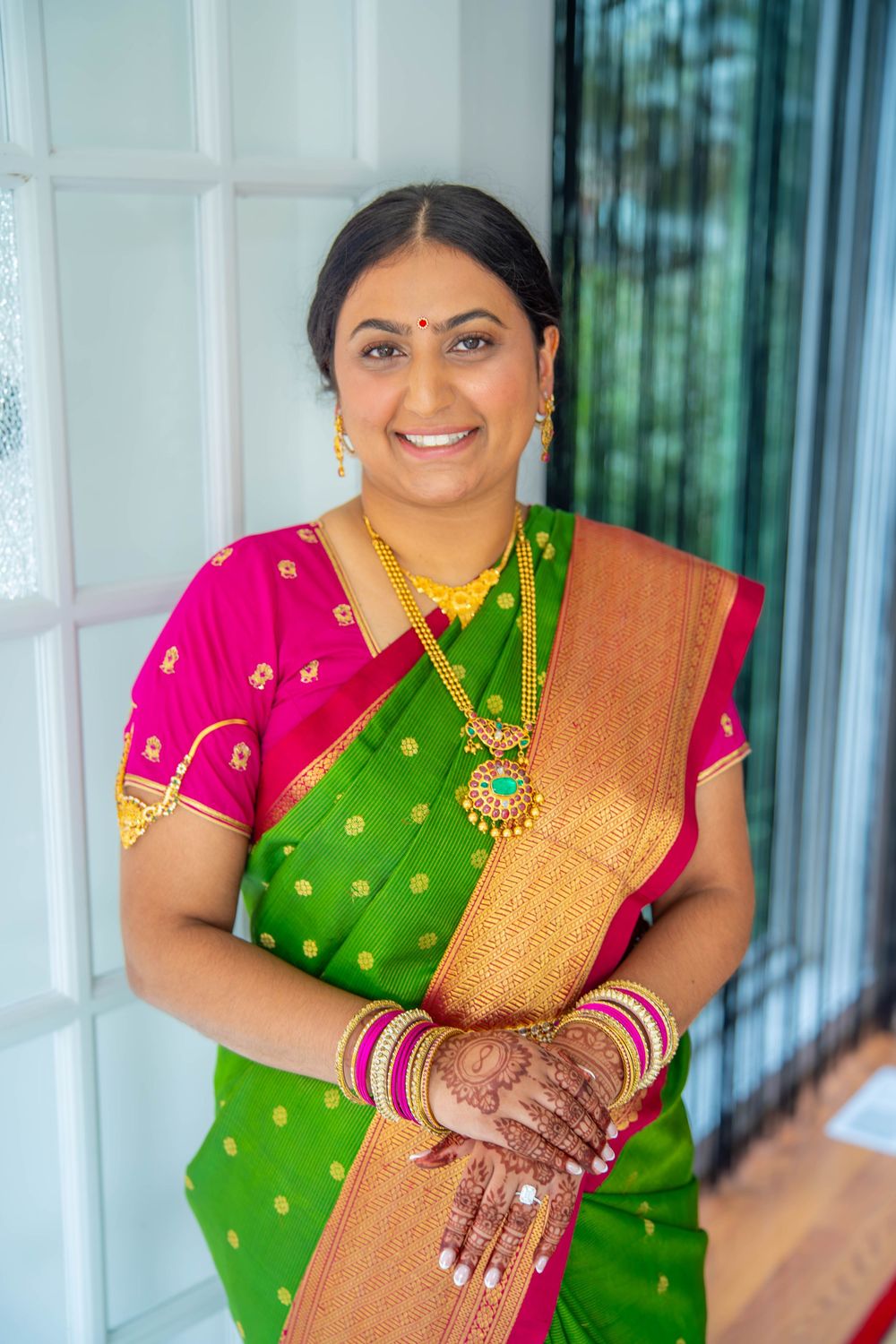 Multiple shots of traditional Indian bridal attire featuring a green silk sari. Nischitartham Quad Cities Hindi Indian Photographer