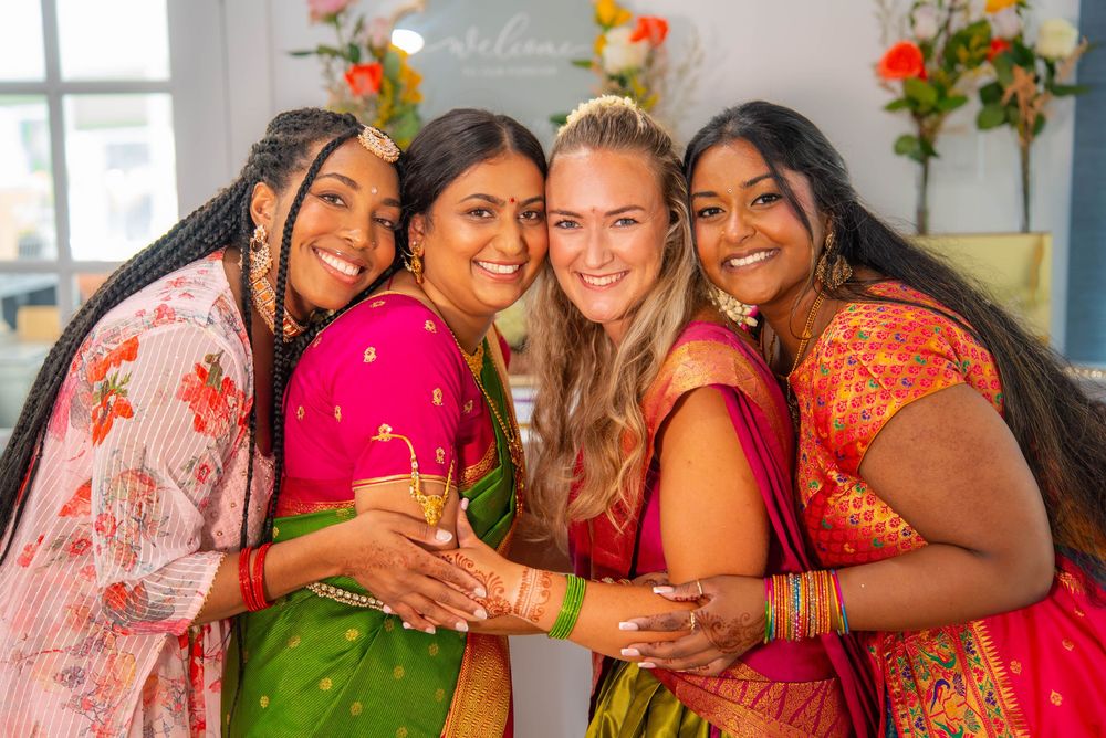 Friends wearing colorful traditional saris pose together. Nischitartham Quad Cities Hindi Indian Photographer