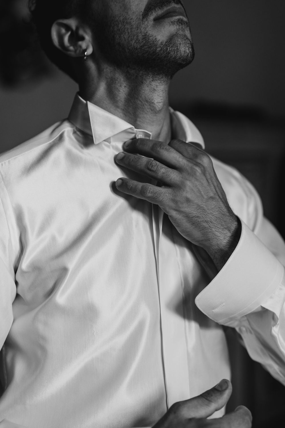 Black and white close-up of formal white dress shirt and collar.