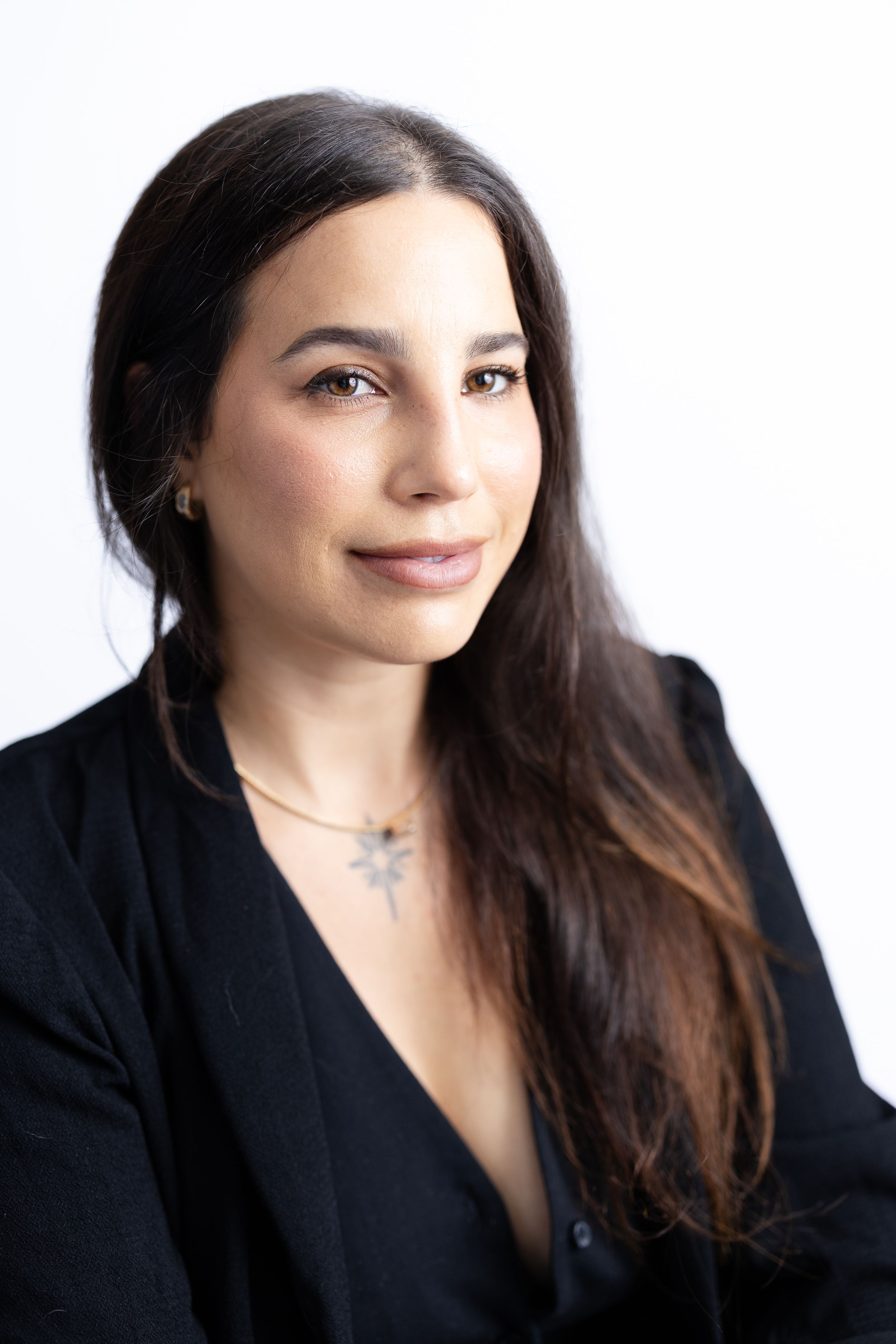 Confident personal brand portrait of professional woman in studio setting. San Diego Photographer
