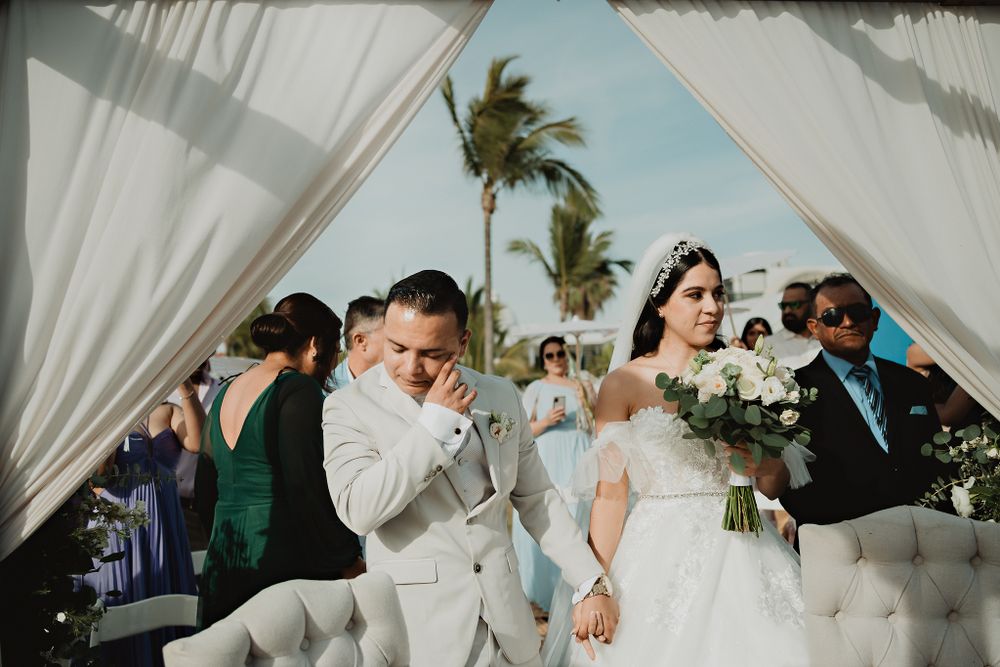 The couple's entrance, with the groom wiping away tears of joy