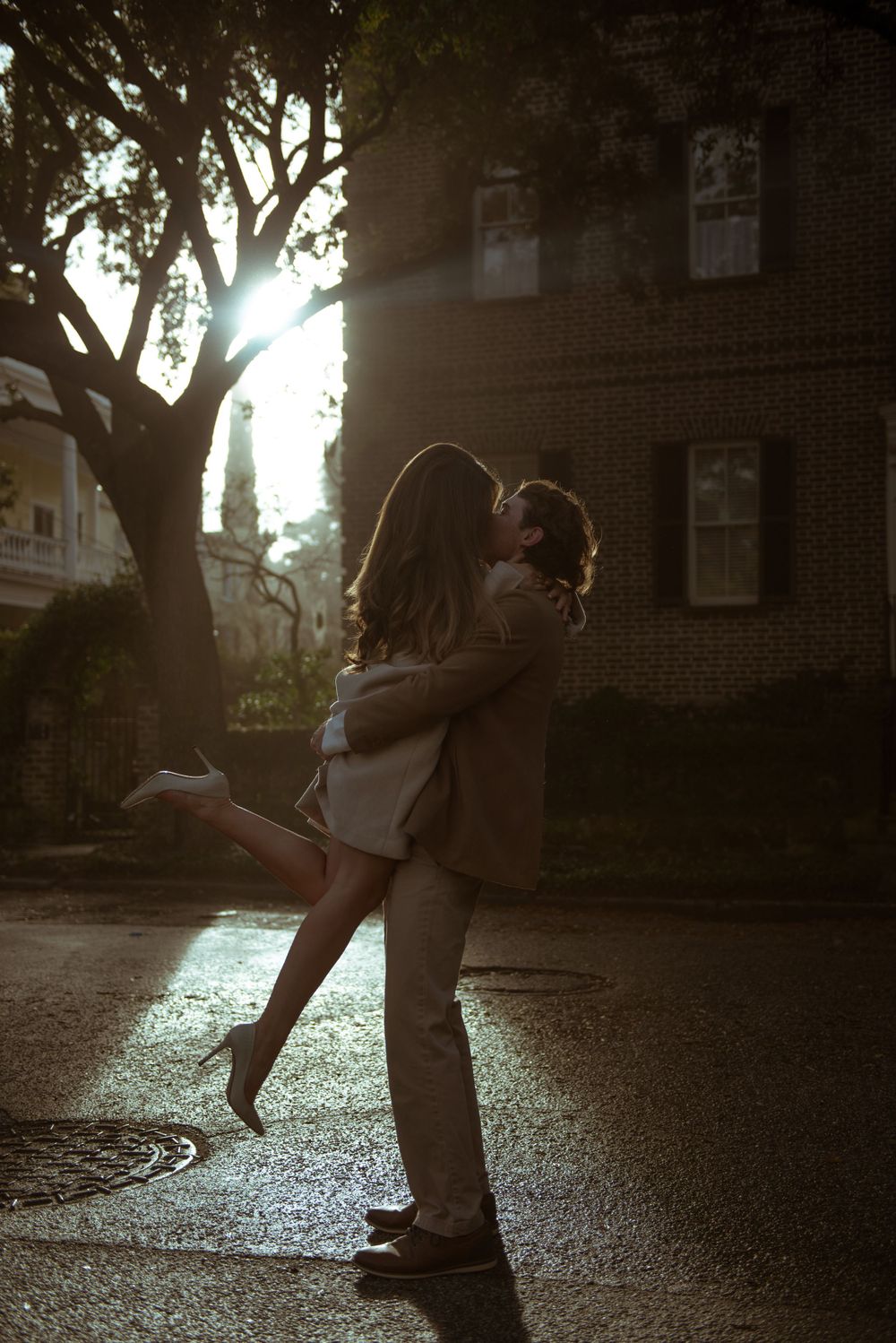 A couple are dancing in the street in downtown Charleston, South Carolina.