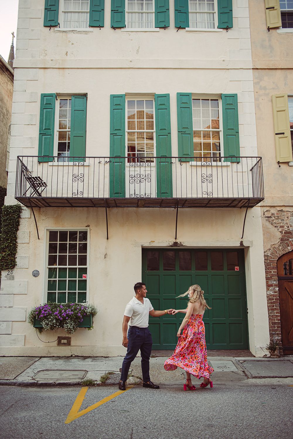 A couple dancing together in the street in downtown Charleston, South Carolina.