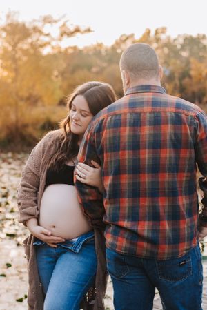 Maternity photography session captures intimate moments at golden hour.
