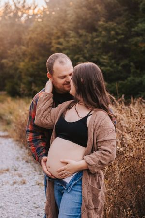 Sweet maternity photography sequence showing couple's loving interaction in natural setting.