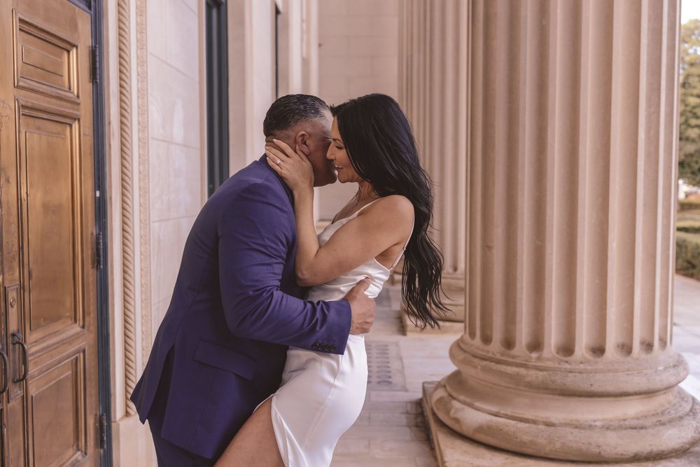 Close up portrait of an engaged couple outside of Mecklenburg Courthouse in Charlotte, North Carolina
