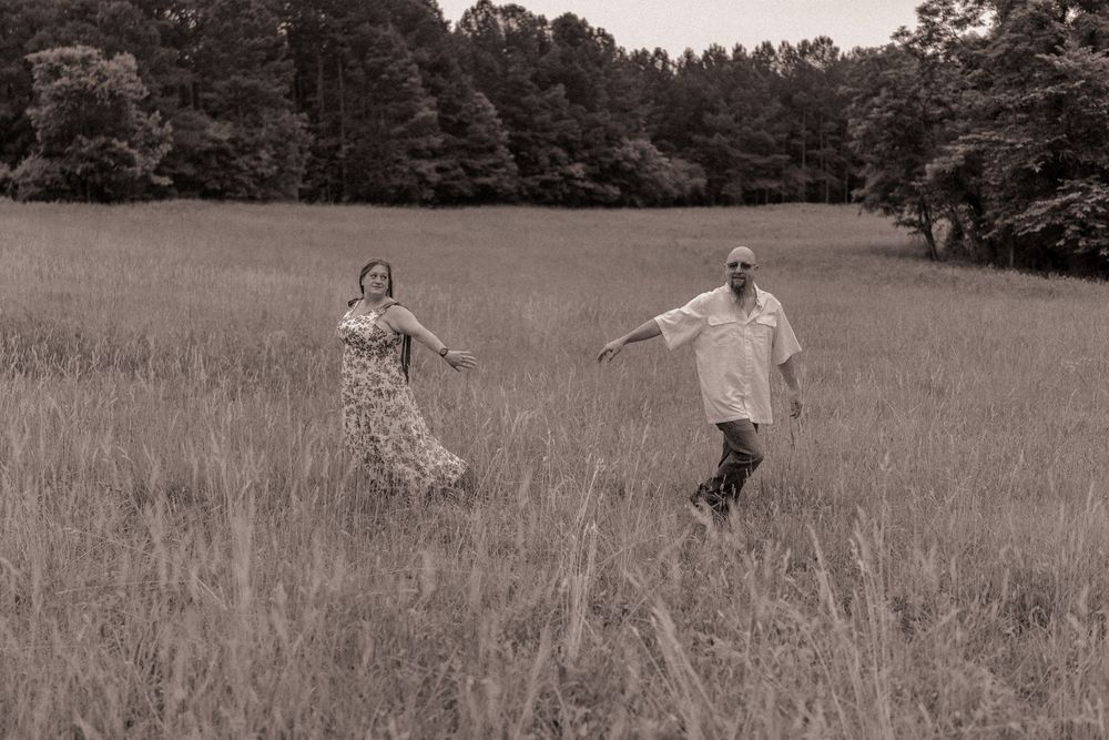 Engaged couple walking away from each other in Charlotte, North Carolina