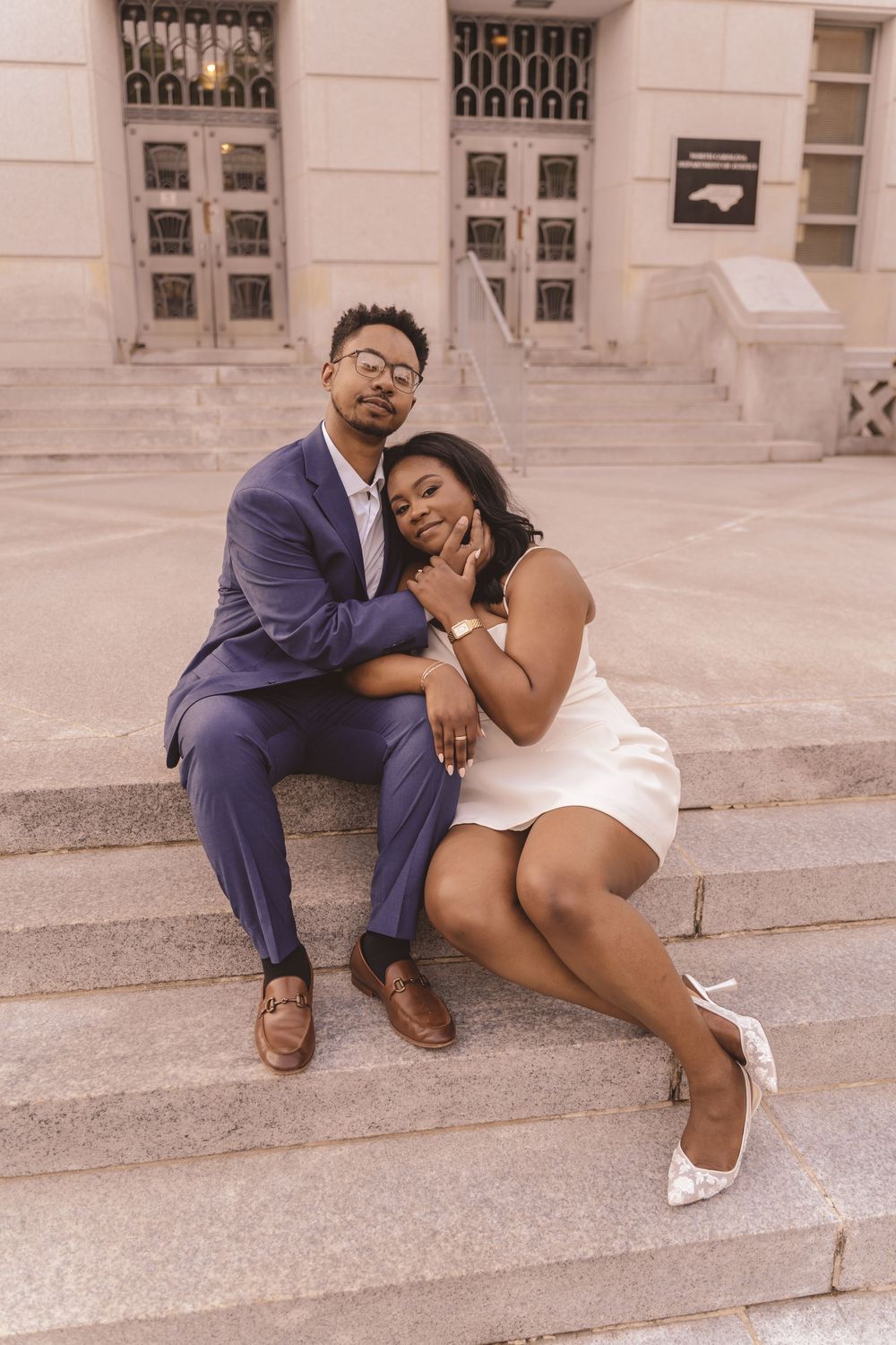 Engaged couple embracing each other in downtown Raleigh, North Carolina