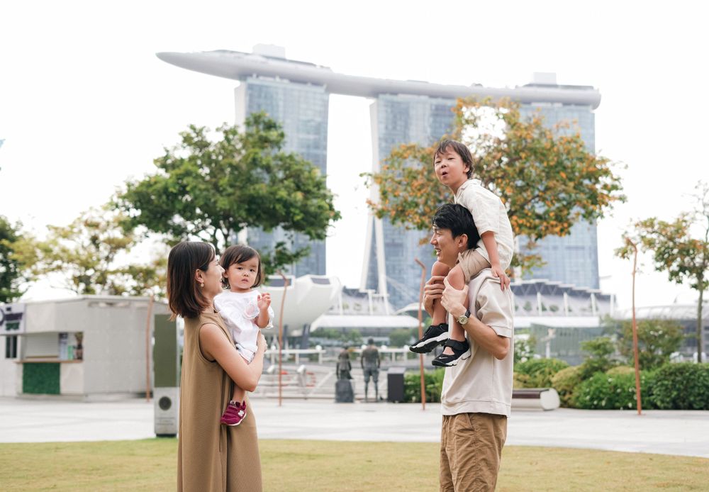 Happy family enjoying quality time together at Marina Bay Sands garden.