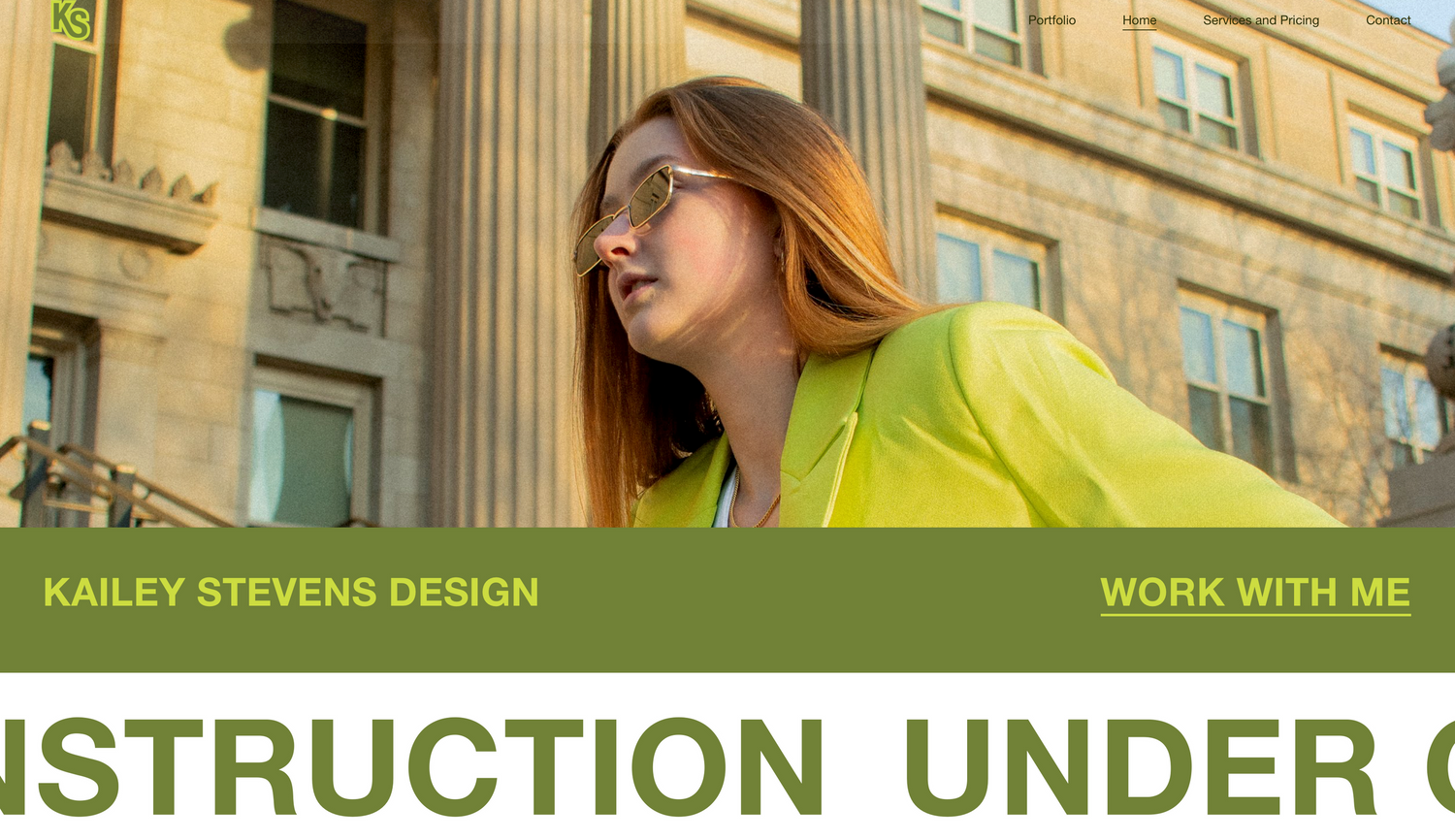 Professional website header with yellow-green banner showing design company branding and navigation menu.