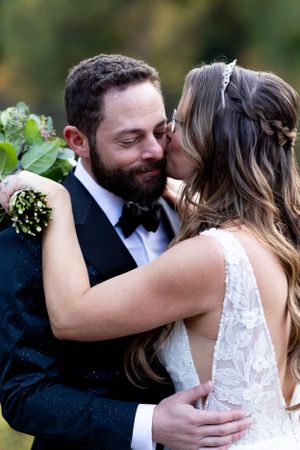 A tender embrace captured during an intimate wedding moment.
