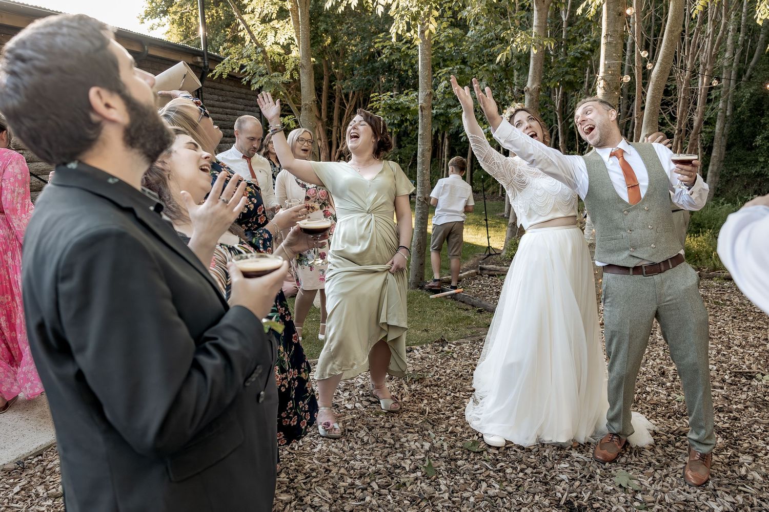 Fun, unobtrusive wedding photography during evening celebrations.