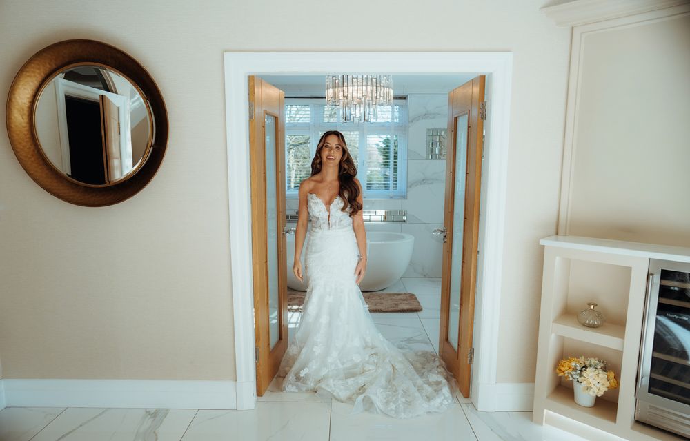 A panoramic sequence of bridal portraits in a bright hallway with mirrors and natural lighting.