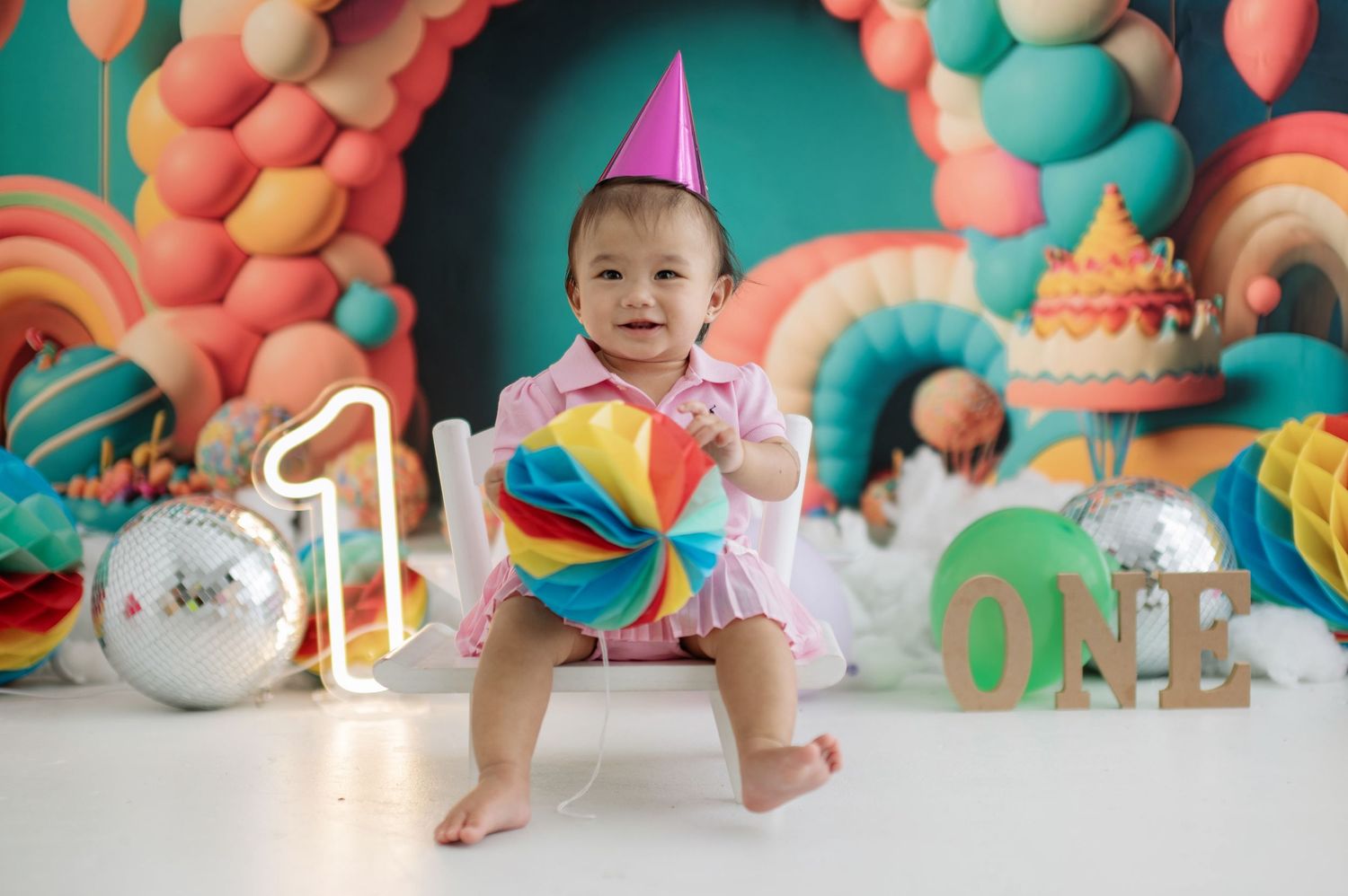 A series of cake smash photos showing a birthday celebration with pink and teal decorations and balloons.