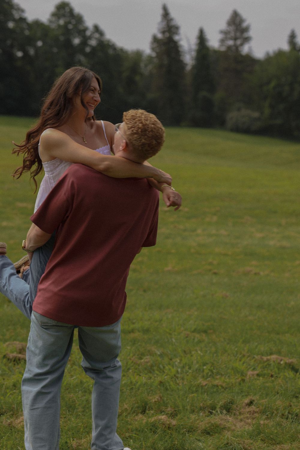 Man holding woman and spinning her around