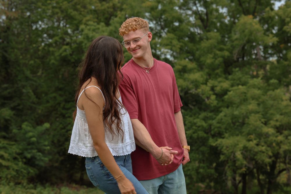 Man and woman holding hands and looking at each other