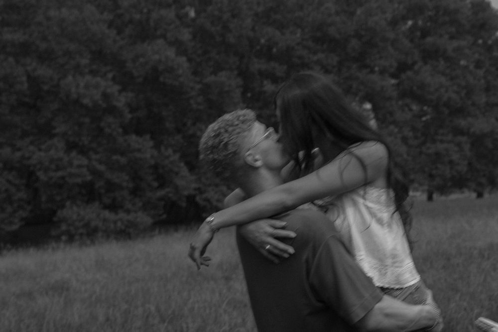 Man holding woman and kissing