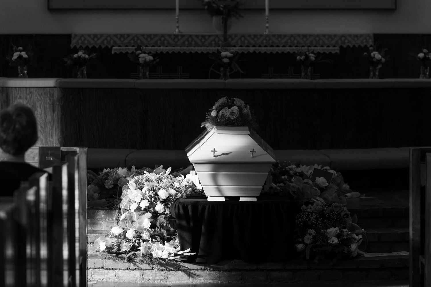 A row of black and white security camera footage stills showing dark outdoor scenes at night.