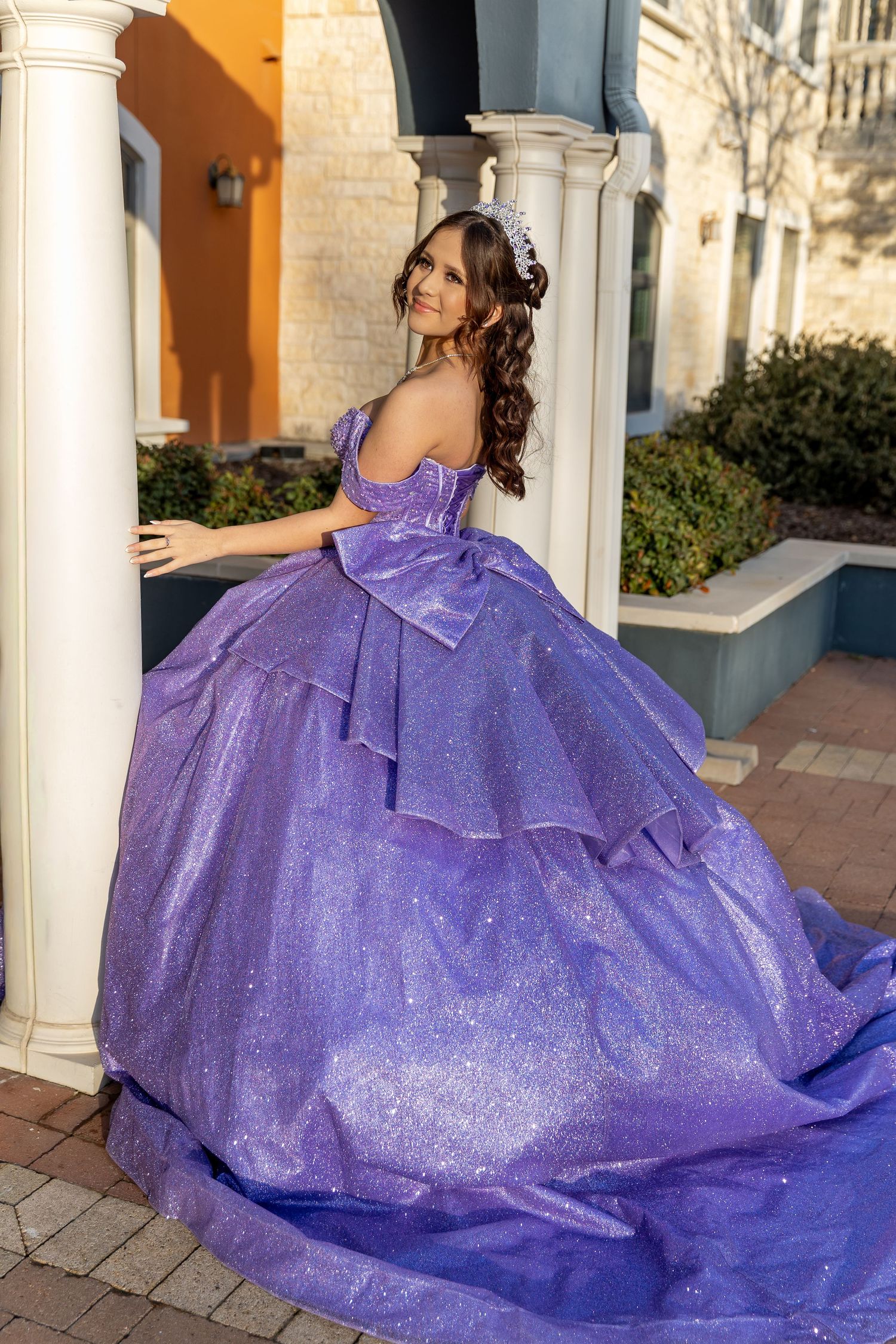 Close-up shots of a woman in a sparkling purple quinceanera dress with crystal jewelry and tiara against an elegant backdrop.