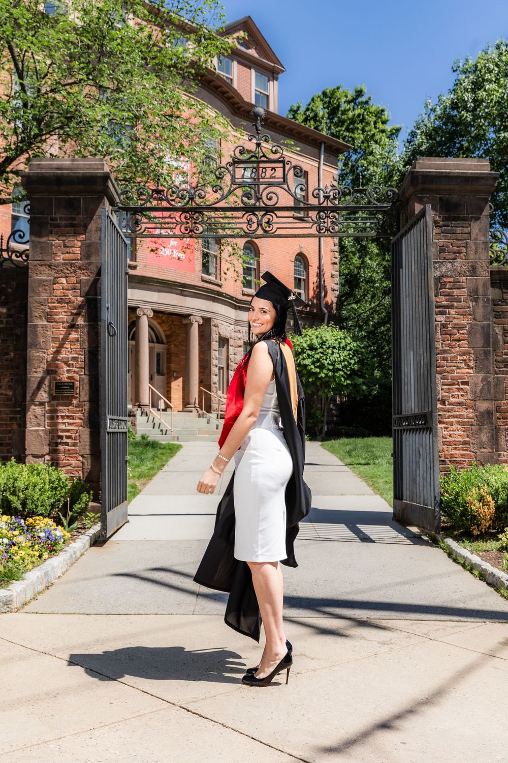 A sequence of photos showing someone walking through an ornate stone gateway entrance on a sunny day.