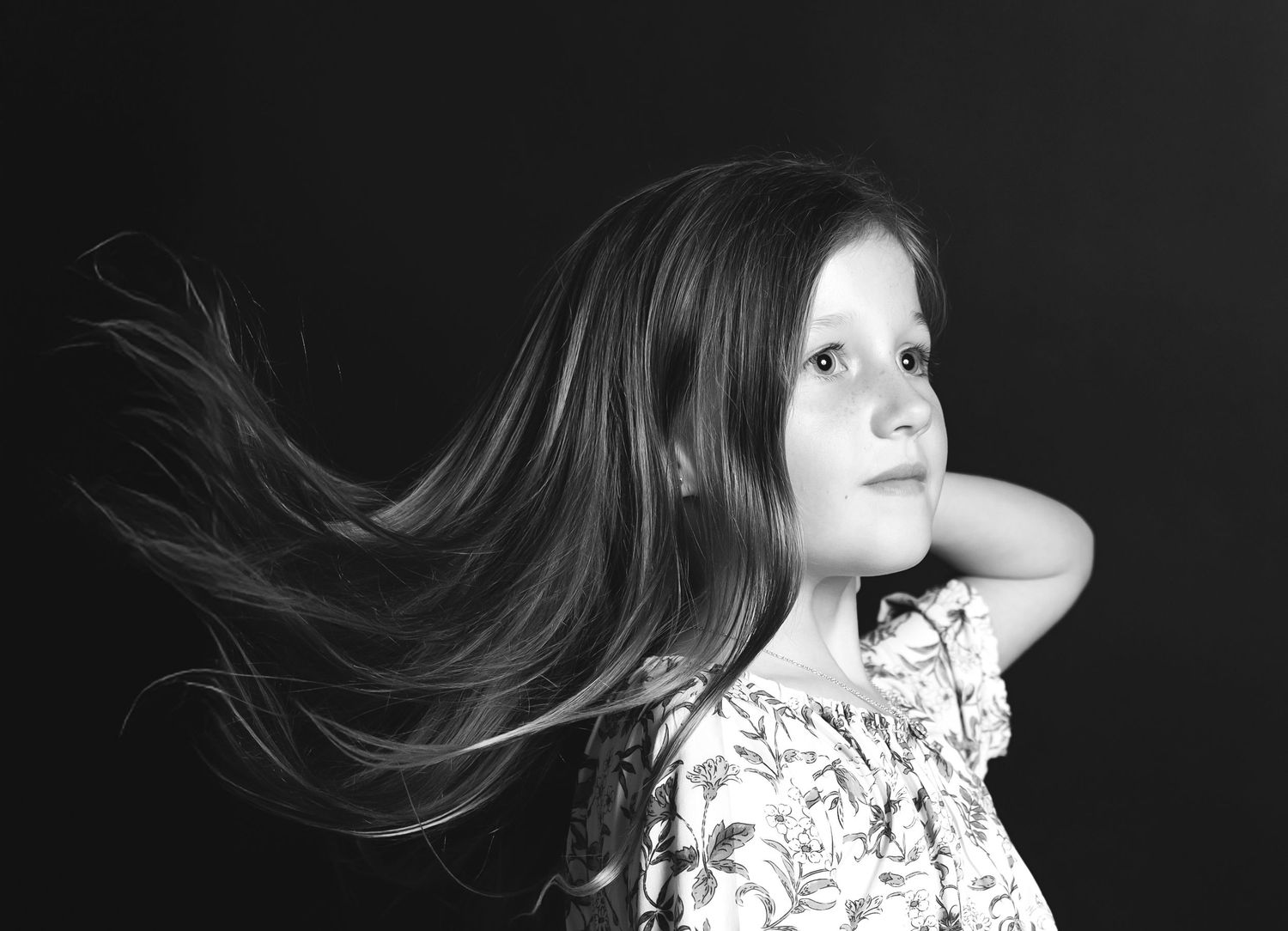 A dramatic black and white photo sequence showing flowing hair movement against a dark background.