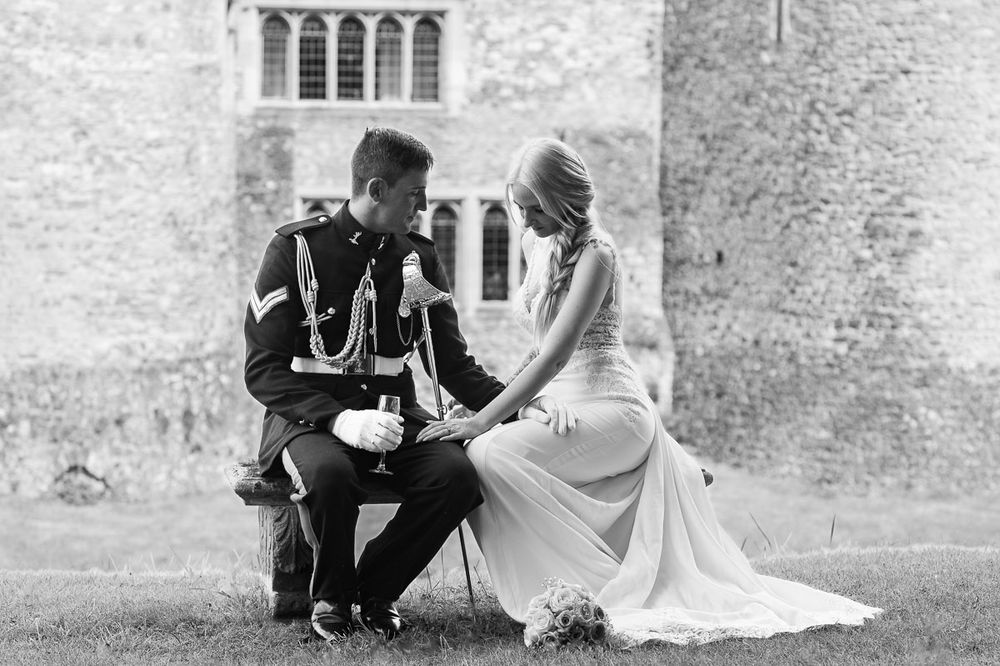 Black and white wedding photo showing intimate moment between couple | Allington Castle in Kent