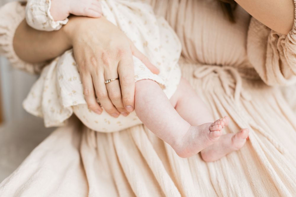 A close up of bare newborn feet for newborn photos in North Andover MA. Newburyport, Southern Maine, Rochester newborn photographer