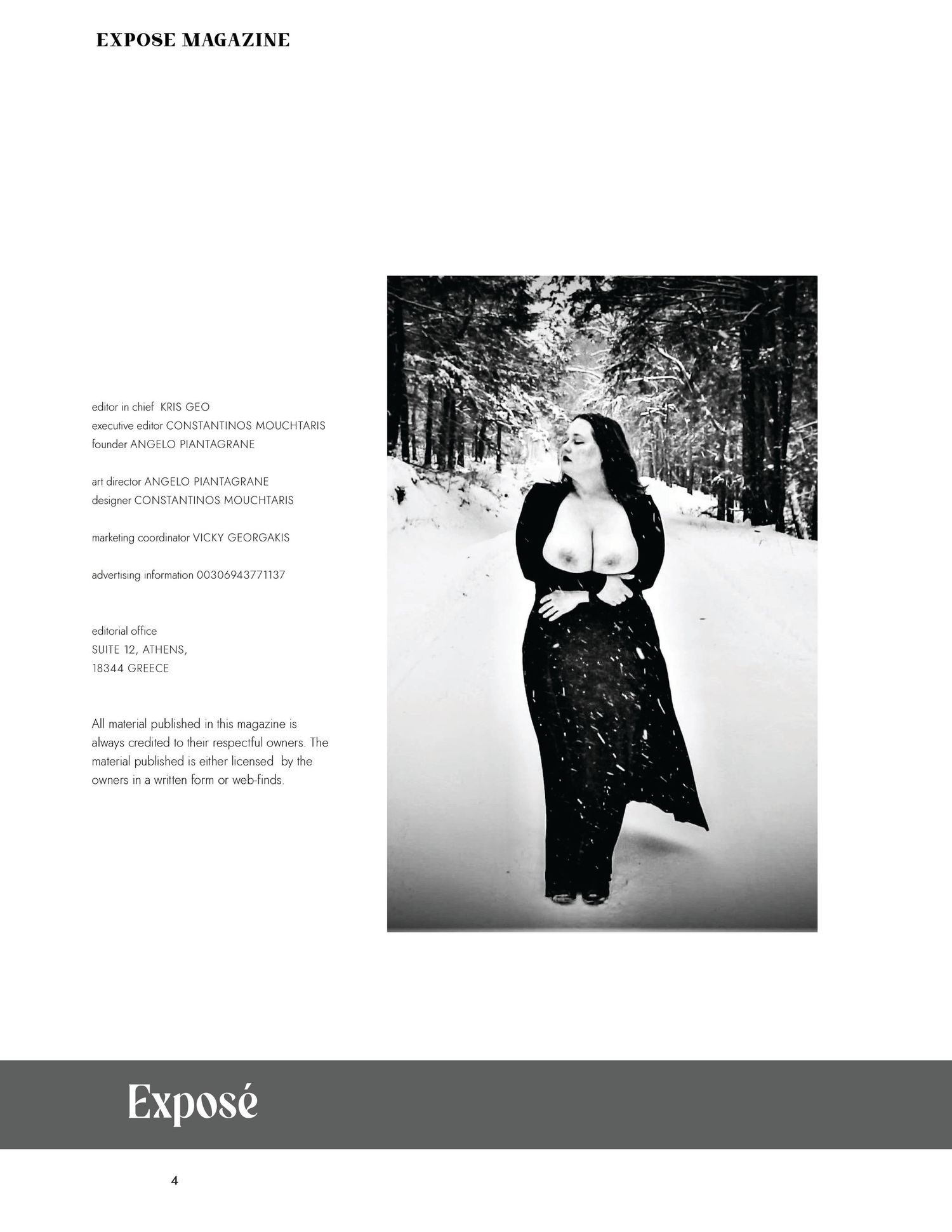 A figure in black clothing stands in a snowy winter forest landscape captured in black and white photography.