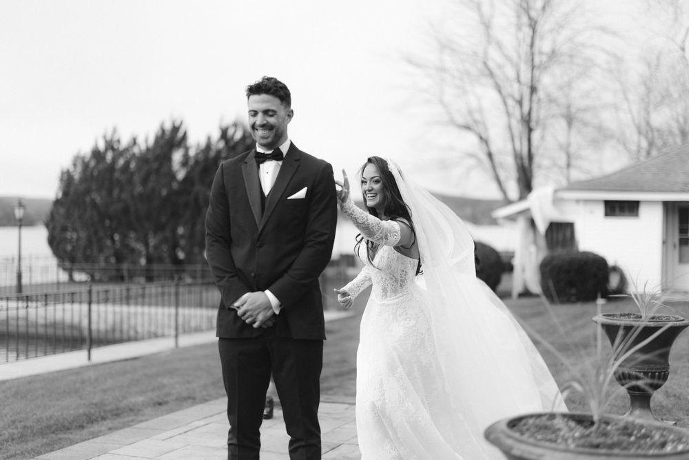 A collection of black and white wedding photos showing romantic moments between newlyweds in outdoor settings.